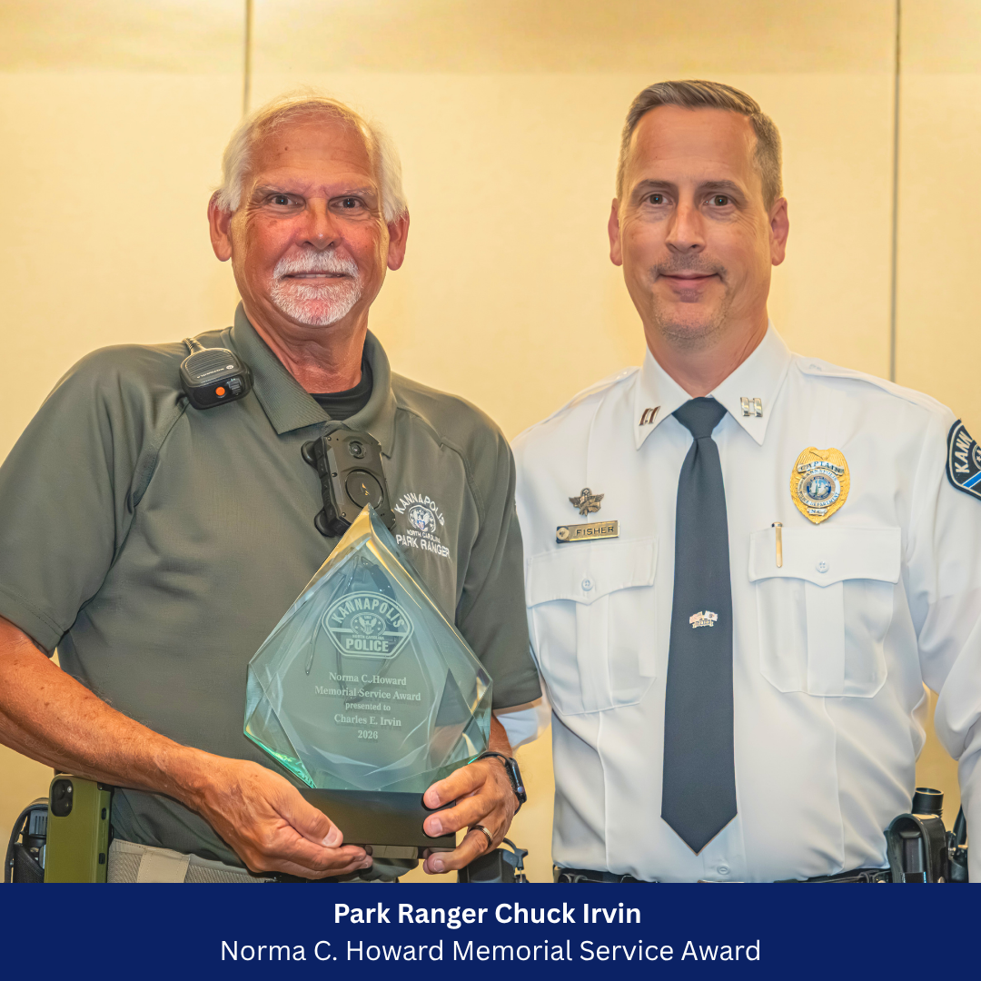 Chuck Irving receiving award from Captain Fisher 